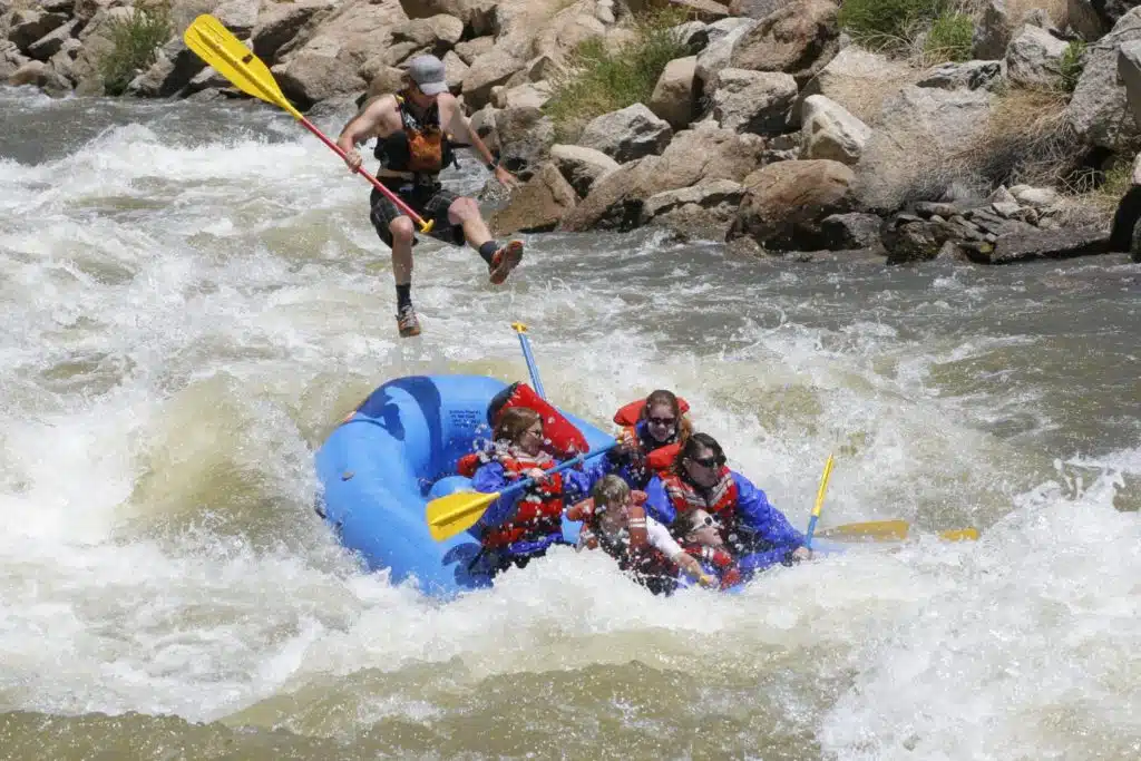 man flies out of the raft