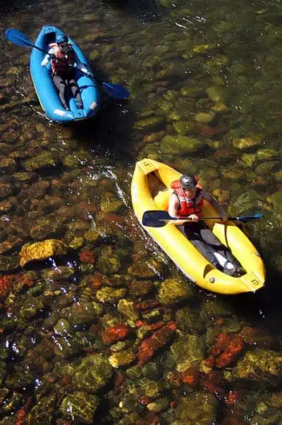 two kayaks in shallow water