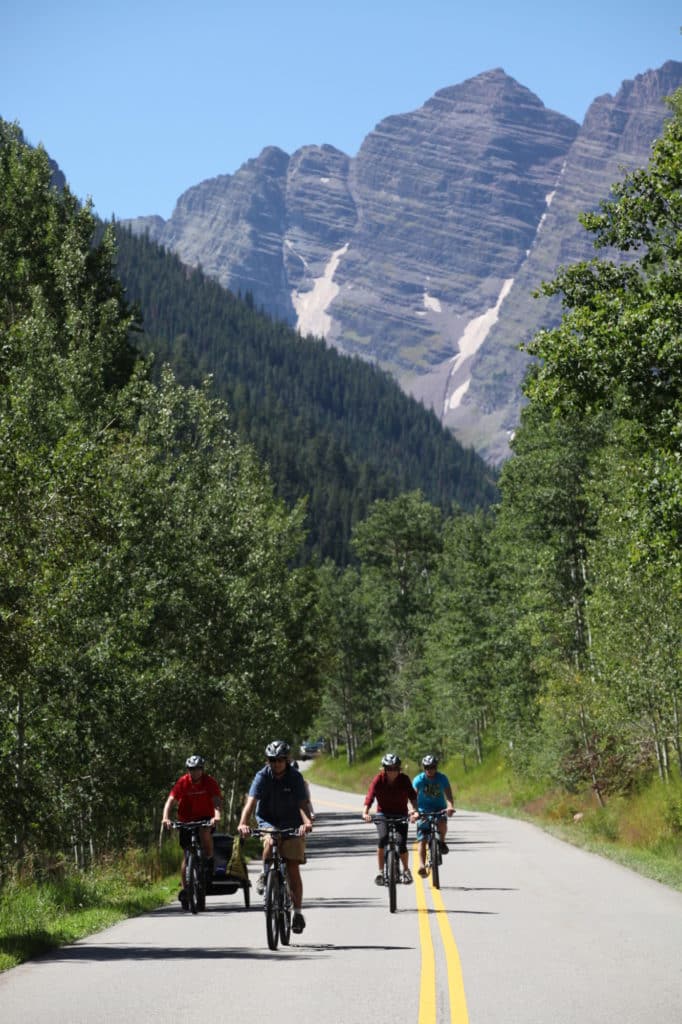 group comes down the road on bikes