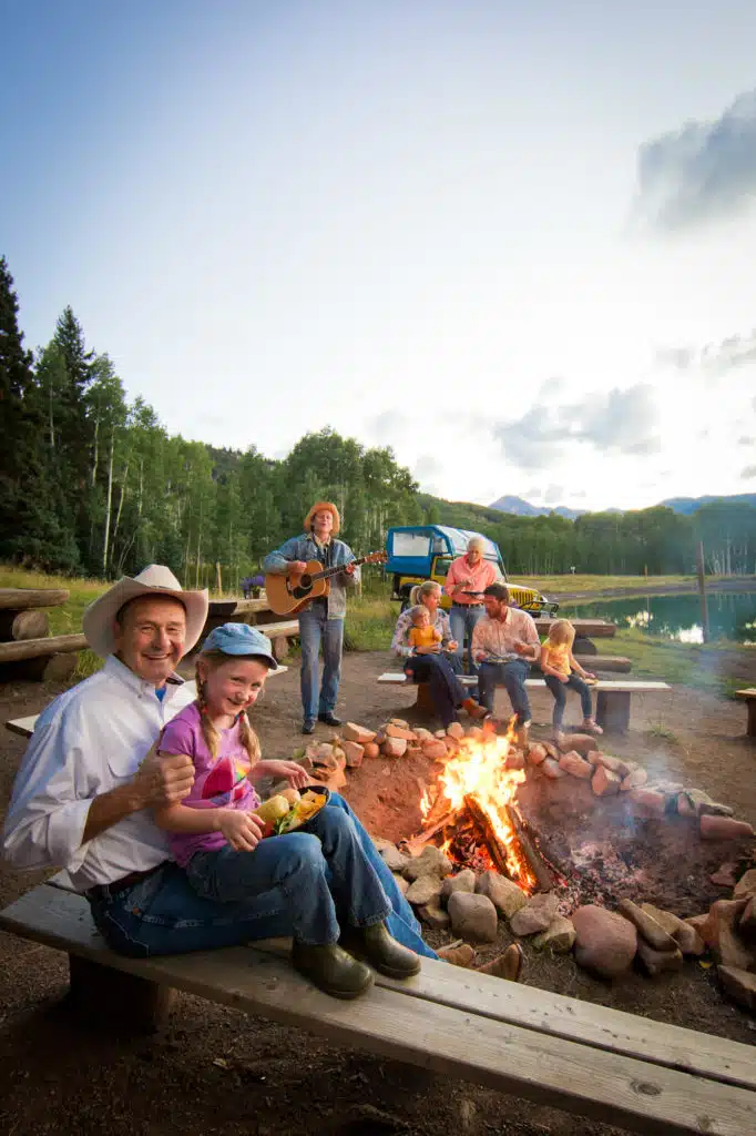 family at a camp fire