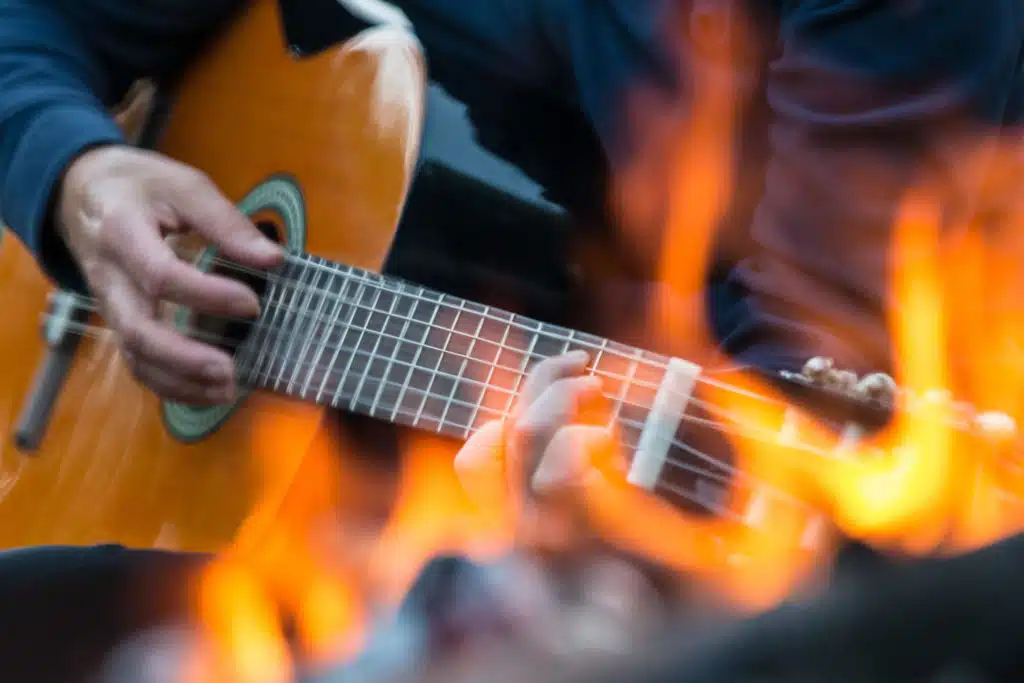 strumming a guitar