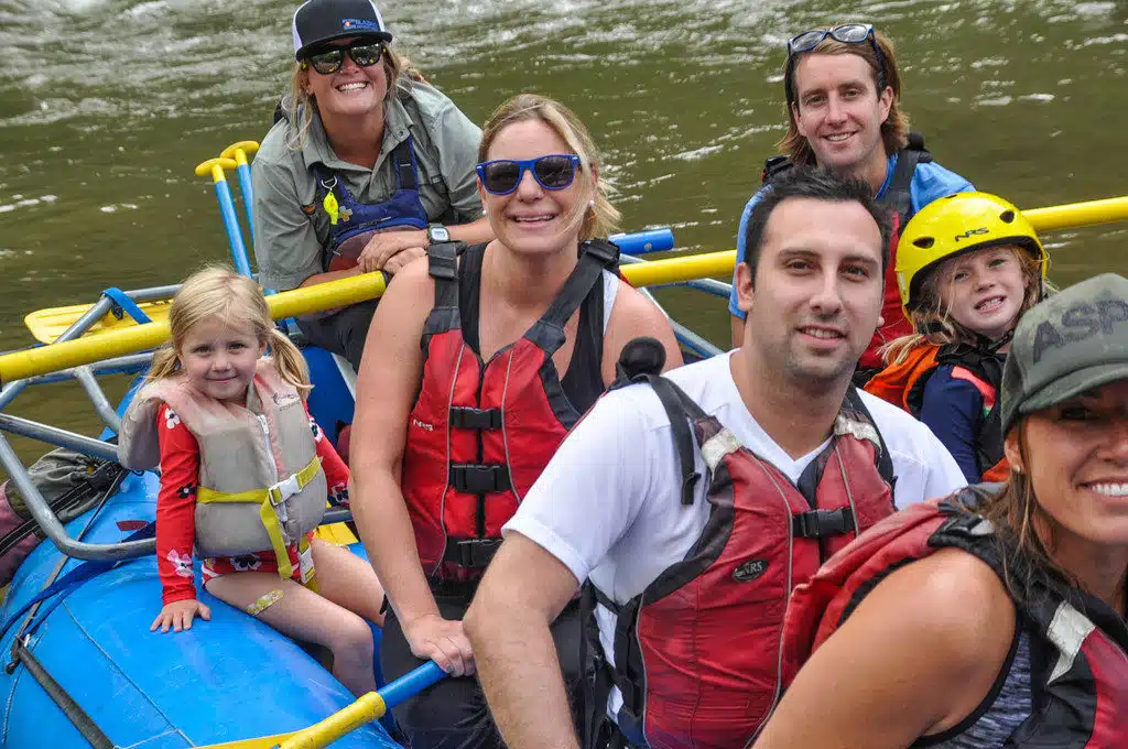 group in a rapids raft