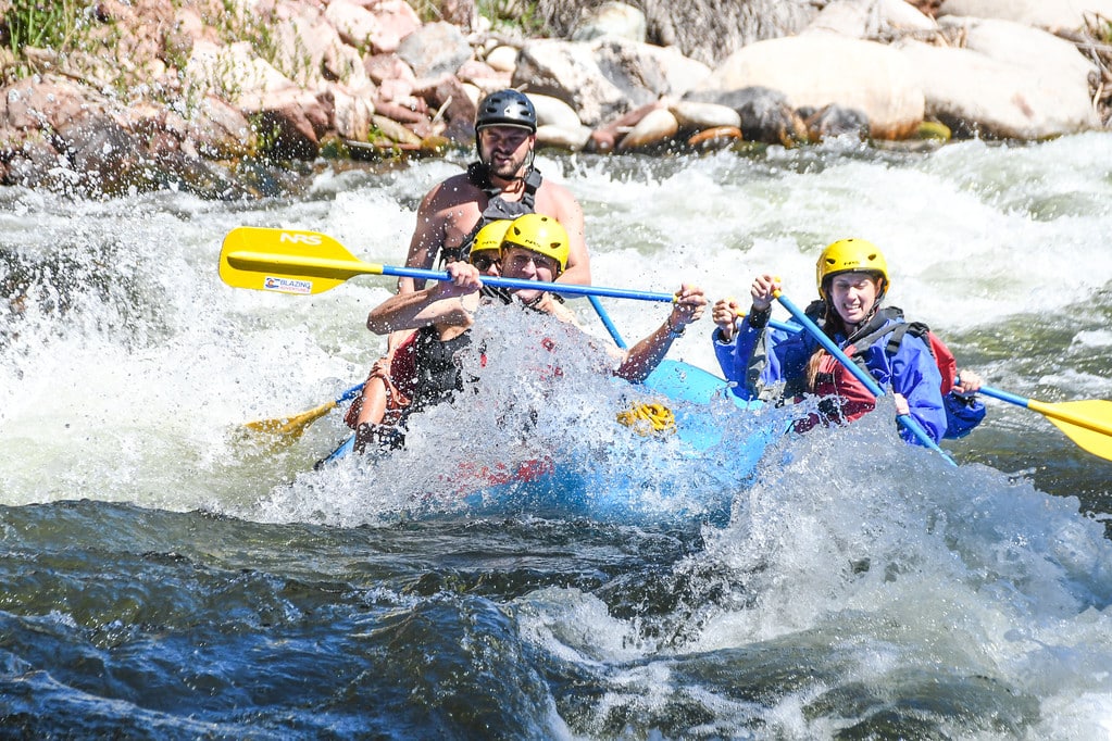 group in rapids on raft