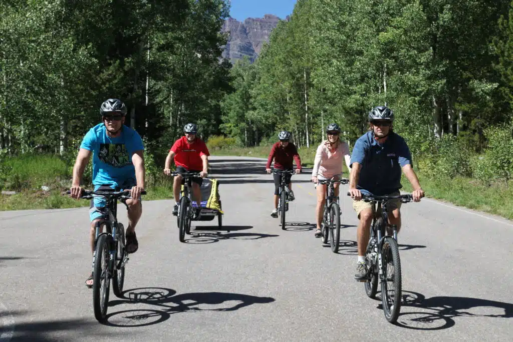 team biking in forest