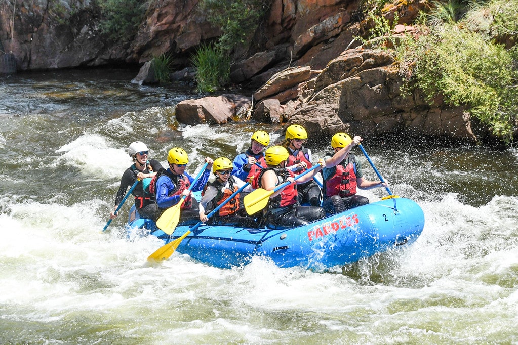 group rafting on rapids