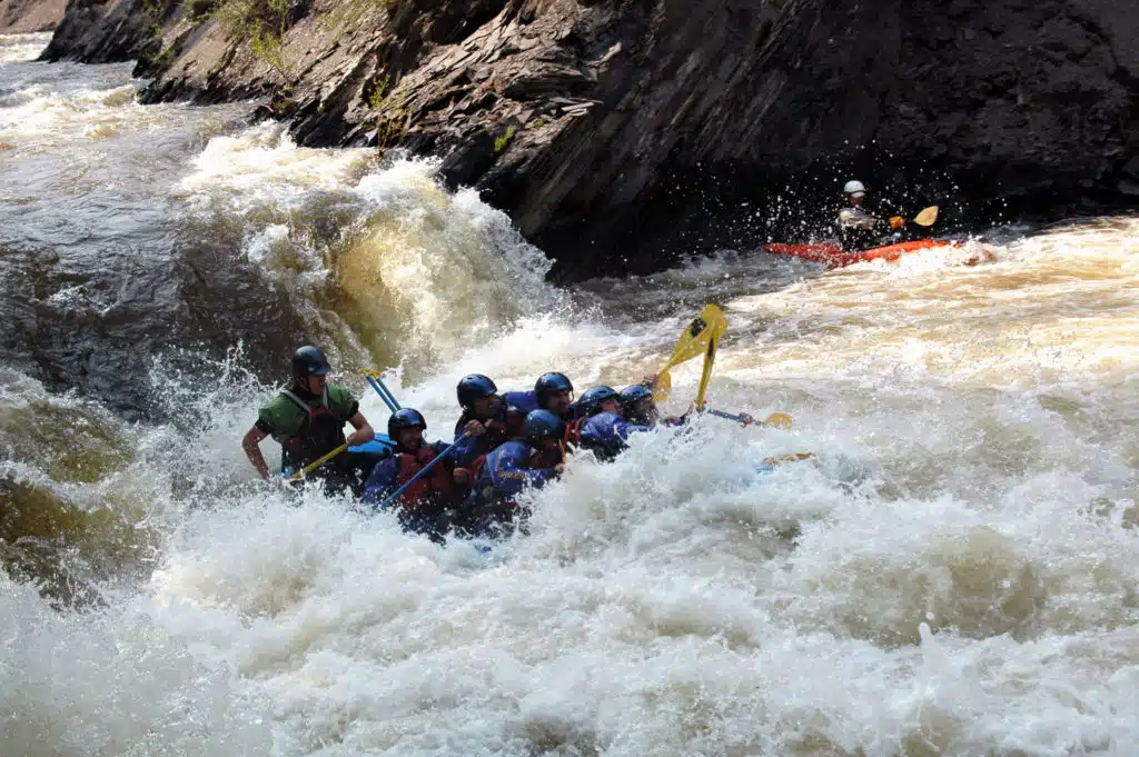 raft goes down the waterfall